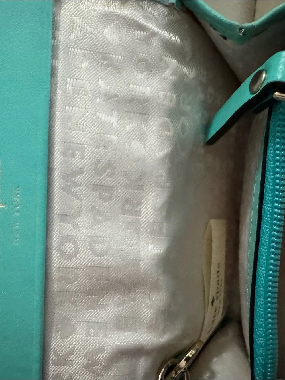 kate spade turquoise wristlet with gold logo
